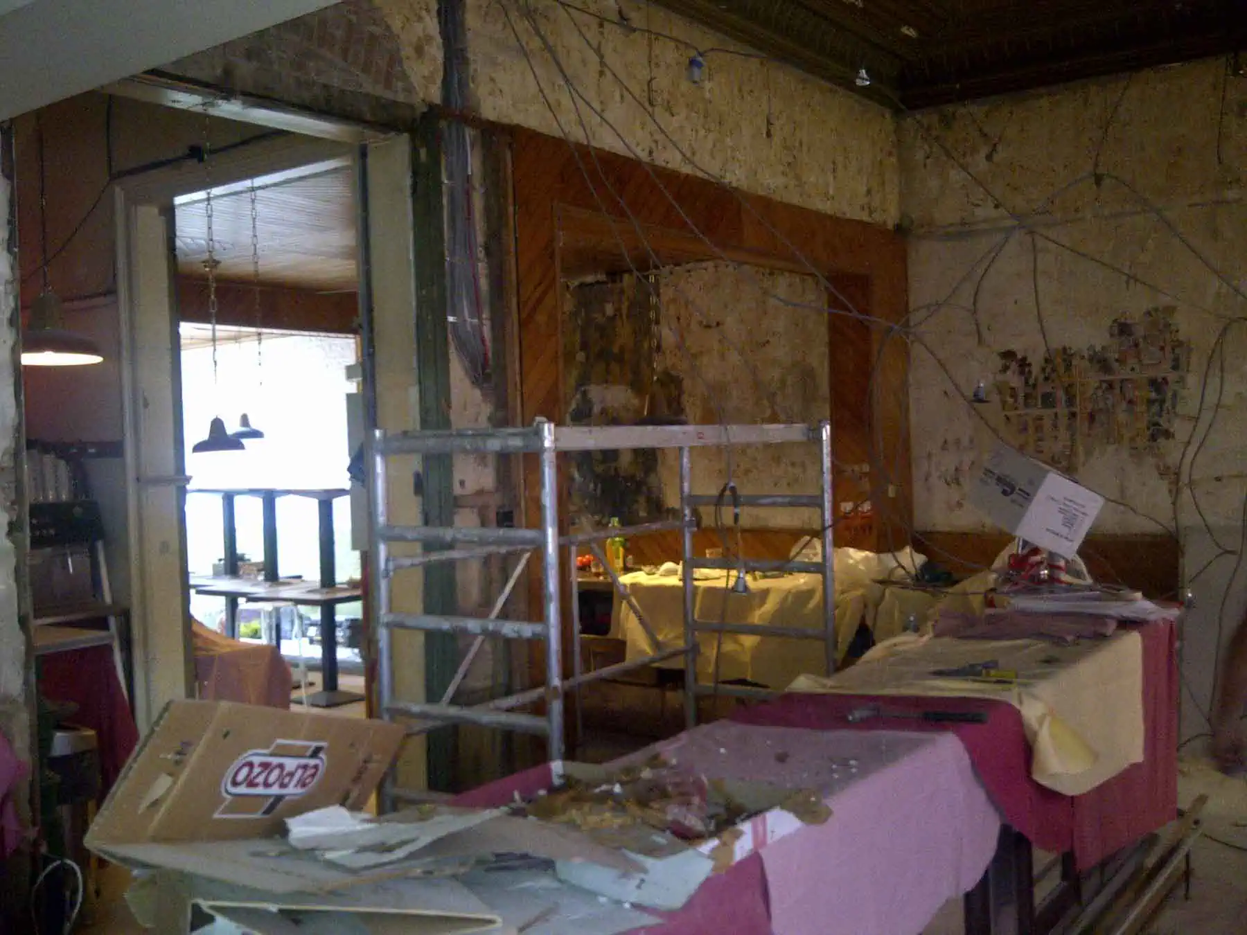 Cosy restaurant in development with open kitchen and creative decor, ready for a refurbishment and new look.